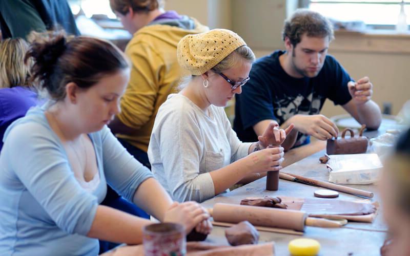 Students work with clay in a Ceramics class